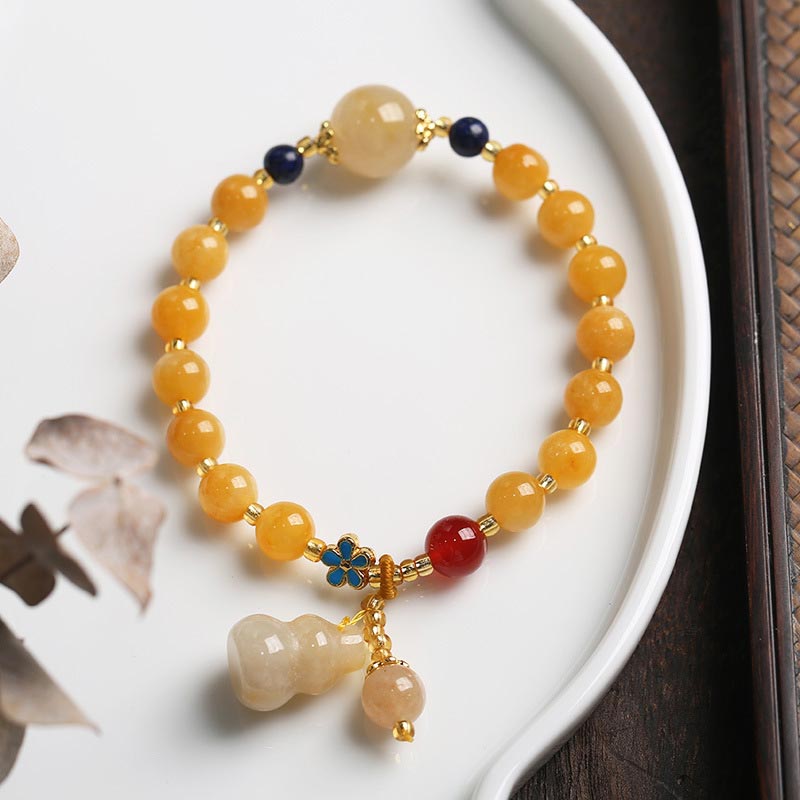 Bracelet porte-bonheur en jade doré et soie naturelle Buddha Stones
