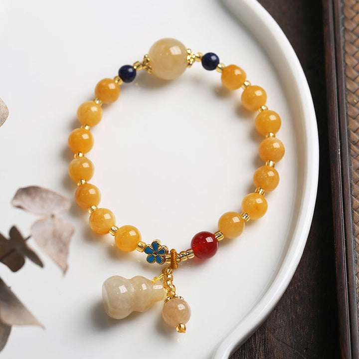 Bracelet porte-bonheur en jade doré et soie naturelle Buddha Stones