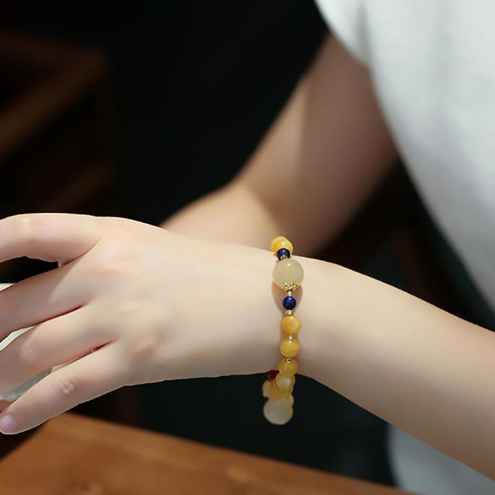 Bracelet porte-bonheur en jade doré et soie naturelle Buddha Stones