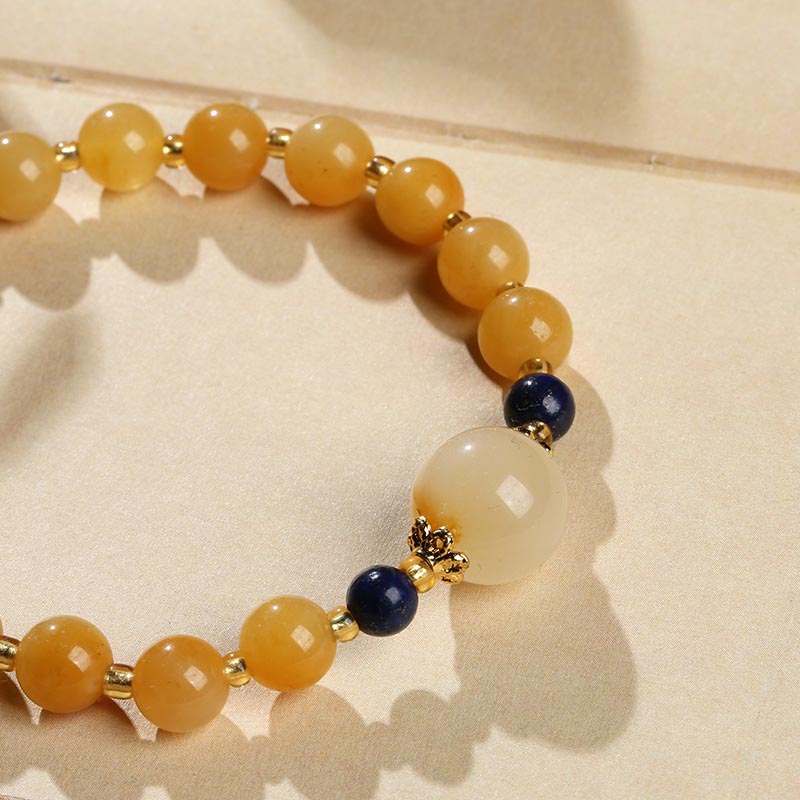 Bracelet porte-bonheur en jade doré et soie naturelle Buddha Stones