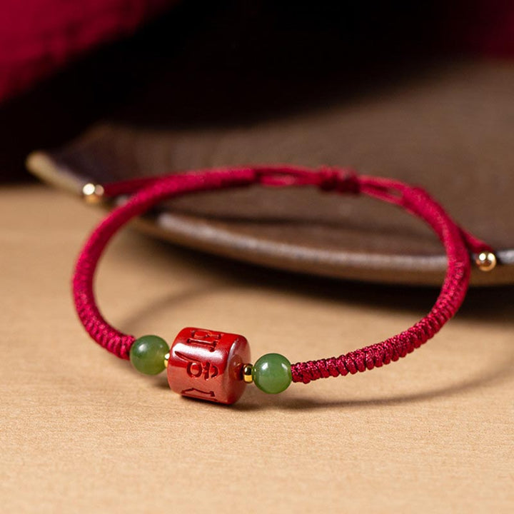 Bracelet en corde tressée avec bénédiction gravée Om Mani Padme Hum et Buddha Stones Tibetam Cinnabar