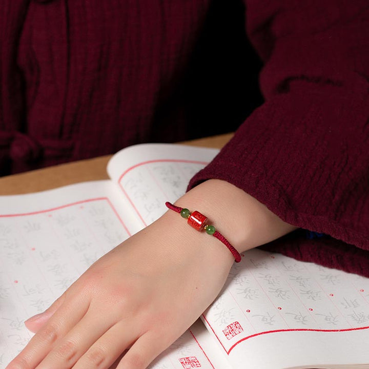 Bracelet en corde tressée avec bénédiction gravée Om Mani Padme Hum et Buddha Stones Tibetam Cinnabar