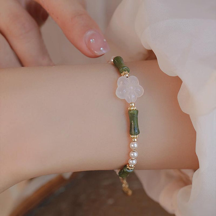 Bracelet de paix en perles d'agate et de fleur de bambou avec Buddha Stones et péridot