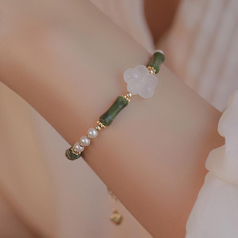 Bracelet de paix en perles d'agate et de fleur de bambou avec Buddha Stones et péridot