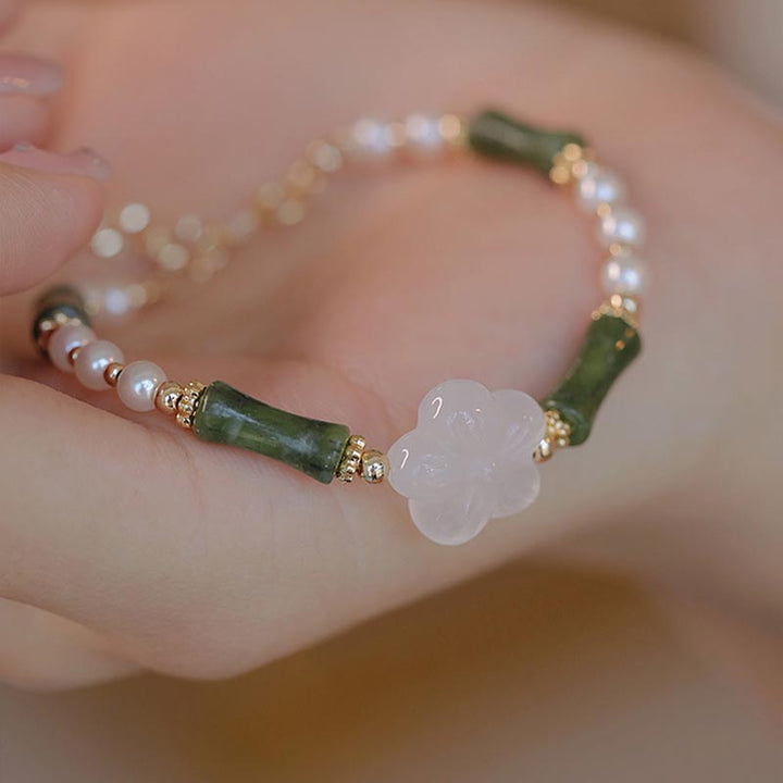 Bracelet de paix en perles d'agate et de fleur de bambou avec Buddha Stones et péridot