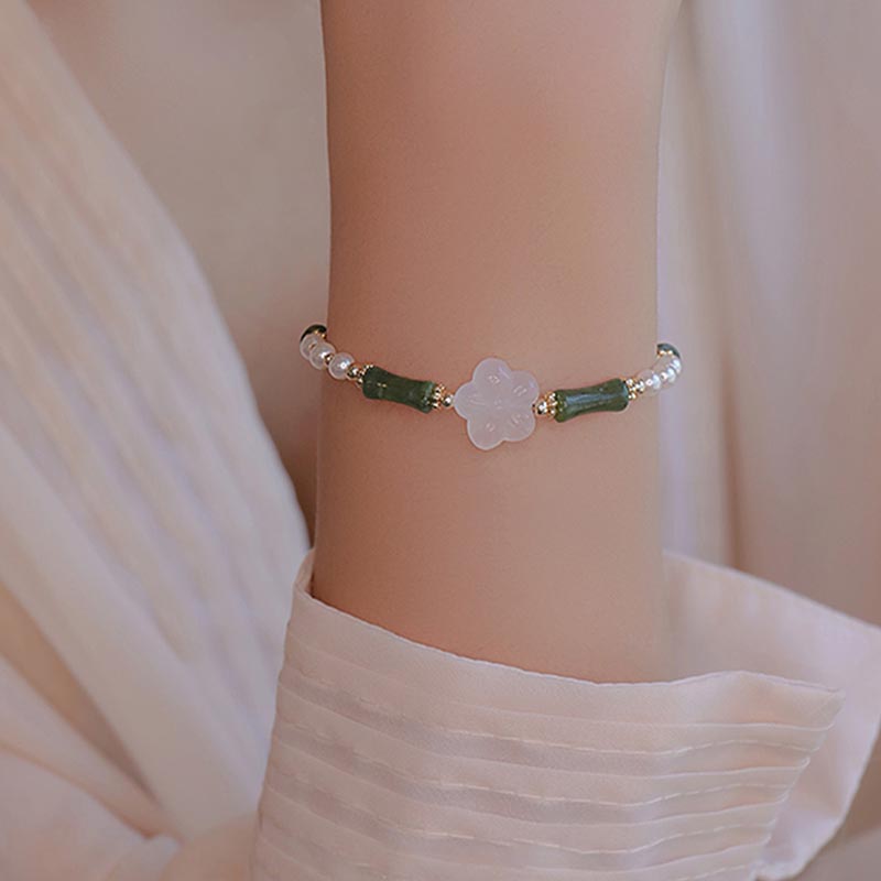 Bracelet de paix en perles d'agate et de fleur de bambou avec Buddha Stones et péridot