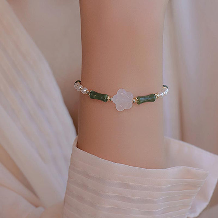 Bracelet de paix en perles d'agate et de fleur de bambou avec Buddha Stones et péridot