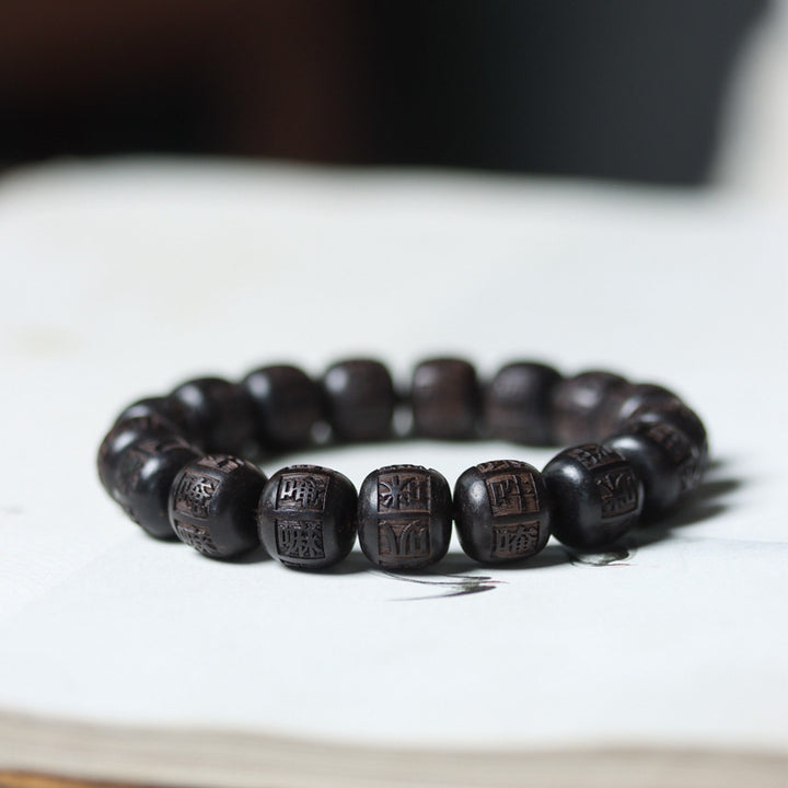 Bracelet d'équilibre gravé en bois d'ébène du Tibet Buddha Stones Om Mani Padme Hum