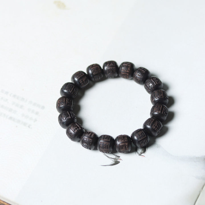Bracelet d'équilibre gravé en bois d'ébène du Tibet Buddha Stones Om Mani Padme Hum