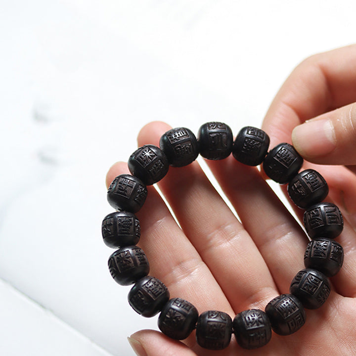 Bracelet d'équilibre gravé en bois d'ébène du Tibet Buddha Stones Om Mani Padme Hum