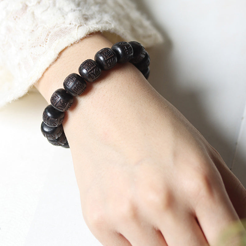Bracelet d'équilibre gravé en bois d'ébène du Tibet Buddha Stones Om Mani Padme Hum