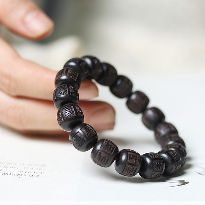 Bracelet d'équilibre gravé en bois d'ébène du Tibet Buddha Stones Om Mani Padme Hum