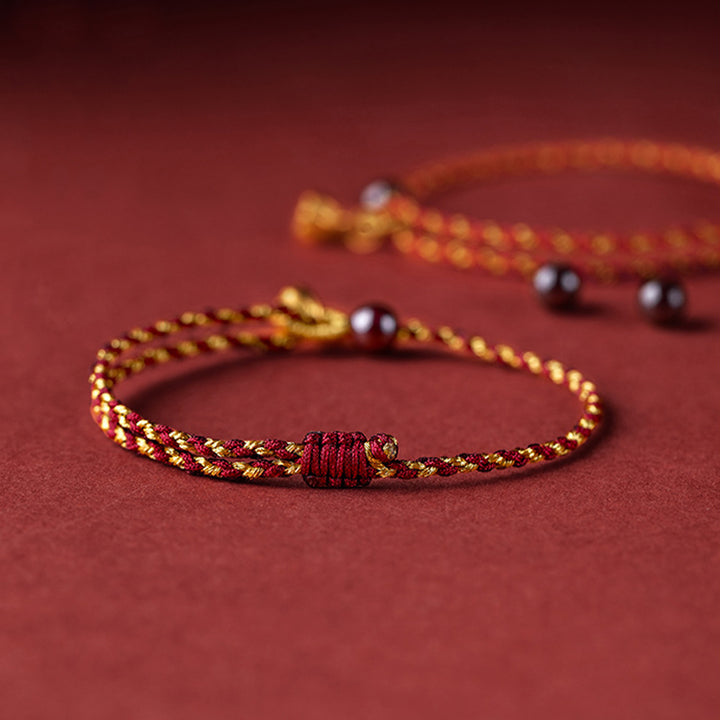Bracelet tressé en corde d'or rouge fabriqué à la main par Buddha Stones avec breloque Lotus Peace And Joy
