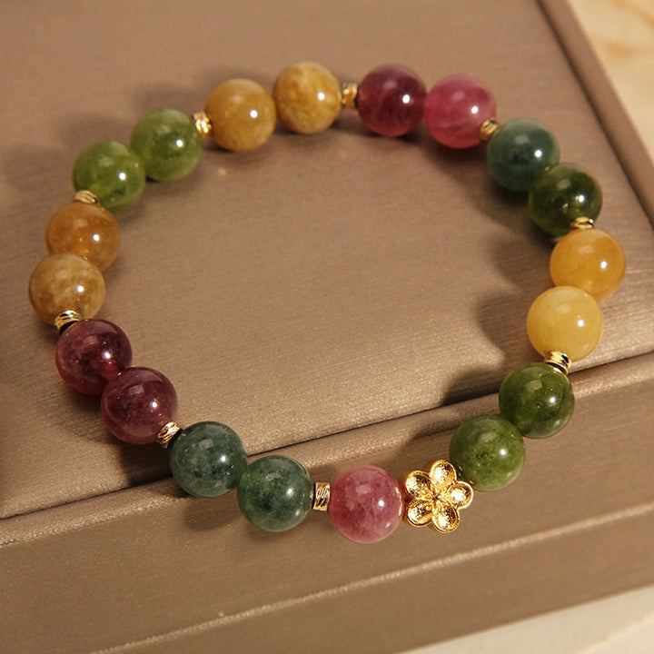Bracelet positif en Buddha Stones avec tourmaline colorée naturelle et fleur dorée