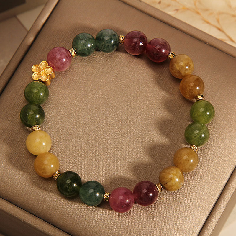 Bracelet positif en Buddha Stones avec tourmaline colorée naturelle et fleur dorée