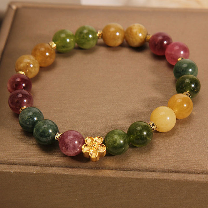 Bracelet positif en Buddha Stones avec tourmaline colorée naturelle et fleur dorée