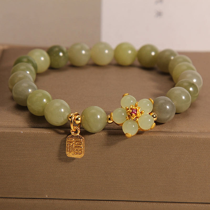 Bracelet porte-bonheur avec breloque en jade vert et fleur de Buddha Stones - Jade (tour de poignet 14-16 cm) - image 0