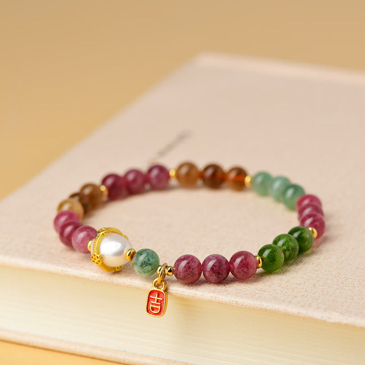 Bracelet de sagesse avec breloque de caractère propice en perles de tourmaline multicolores naturelles de Buddha Stones