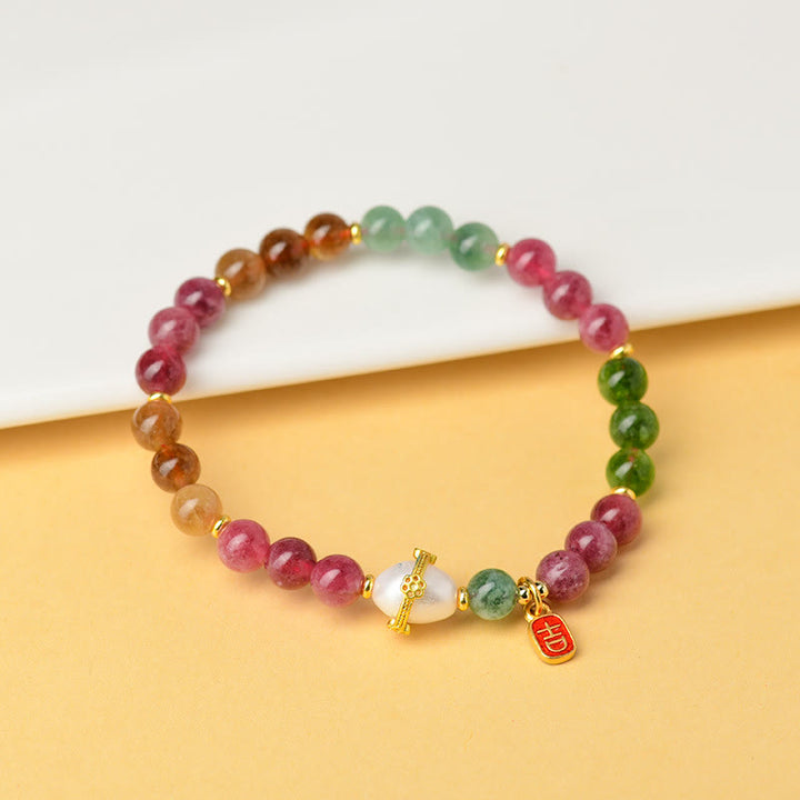 Bracelet de sagesse avec breloque de caractère propice en perles de tourmaline multicolores naturelles de Buddha Stones