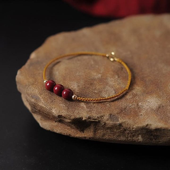 Bracelet tressé en cinabre naturel plaqué or 14 carats de Buddha Stones