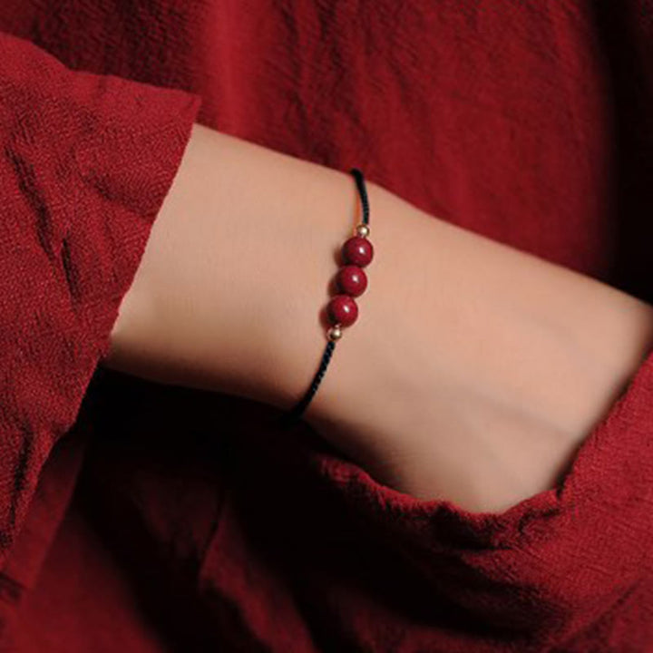 Bracelet tressé en cinabre naturel plaqué or 14 carats de Buddha Stones