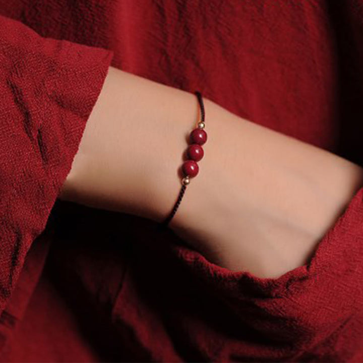 Bracelet tressé en cinabre naturel plaqué or 14 carats de Buddha Stones