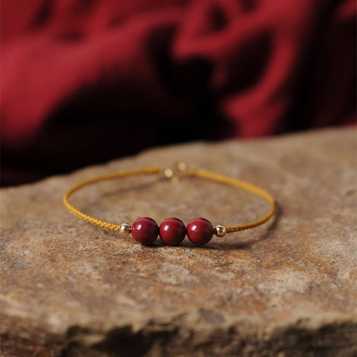 Bracelet tressé en cinabre naturel plaqué or 14 carats de Buddha Stones