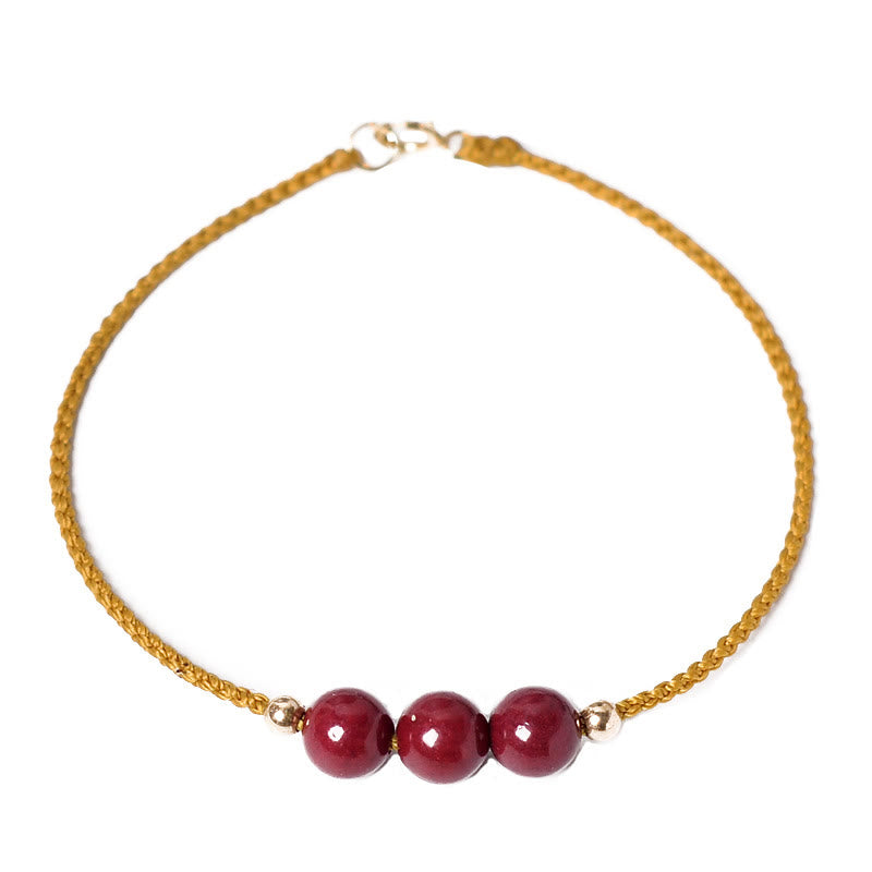 Bracelet tressé en cinabre naturel plaqué or 14 carats de Buddha Stones