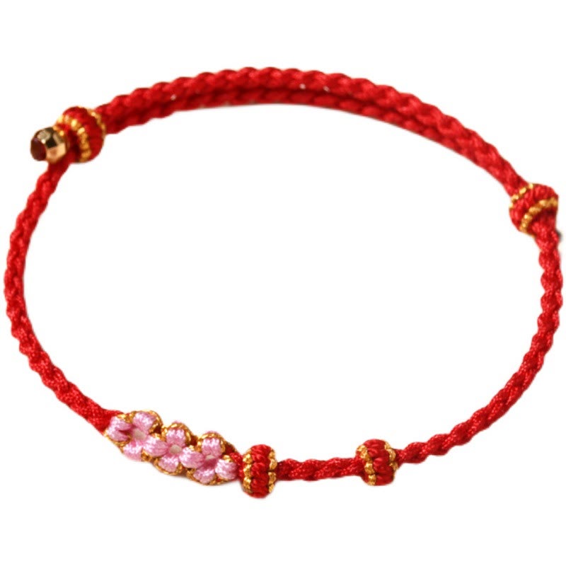 Bracelet tressé en corde de protection en fleur de pêcher fait main par Buddha Stones