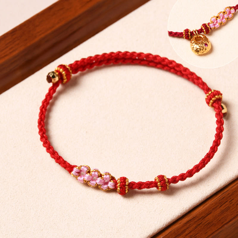 Bracelet tressé en corde de protection en fleur de pêcher fait main par Buddha Stones