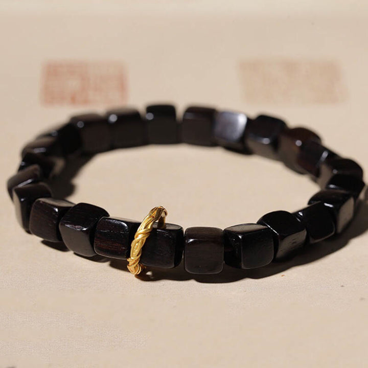 Bracelet de perles carrées en bois d'ébène tibétain Buddha Stones Peace Calm