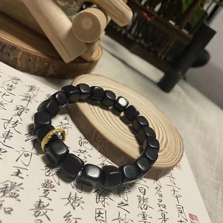 Bracelet de perles carrées en bois d'ébène tibétain Buddha Stones Peace Calm