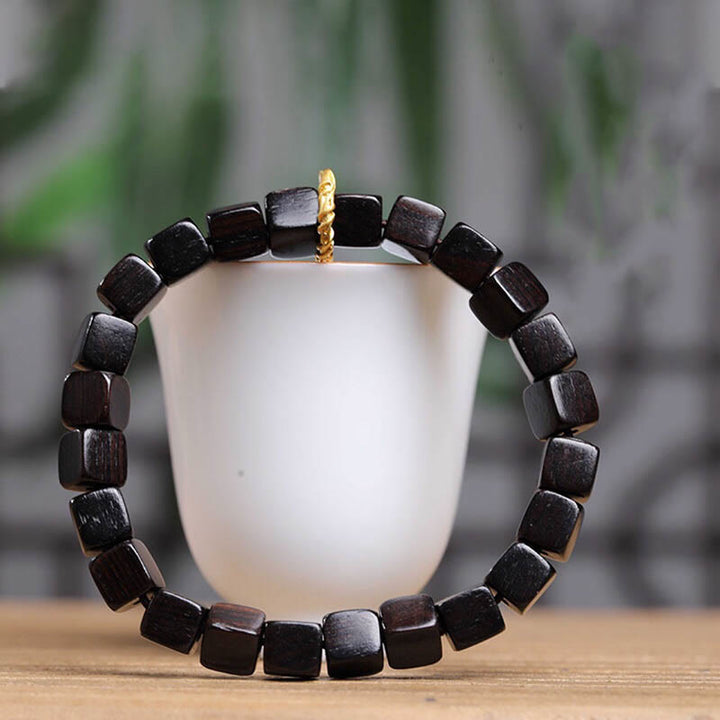 Bracelet de perles carrées en bois d'ébène tibétain Buddha Stones Peace Calm