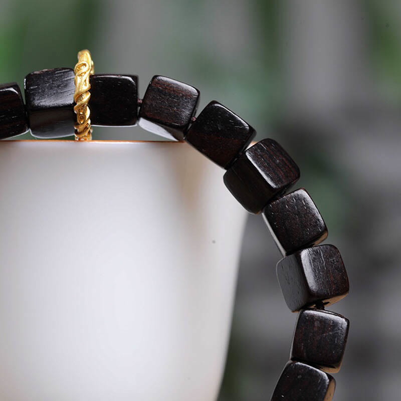 Bracelet de perles carrées en bois d'ébène tibétain Buddha Stones Peace Calm