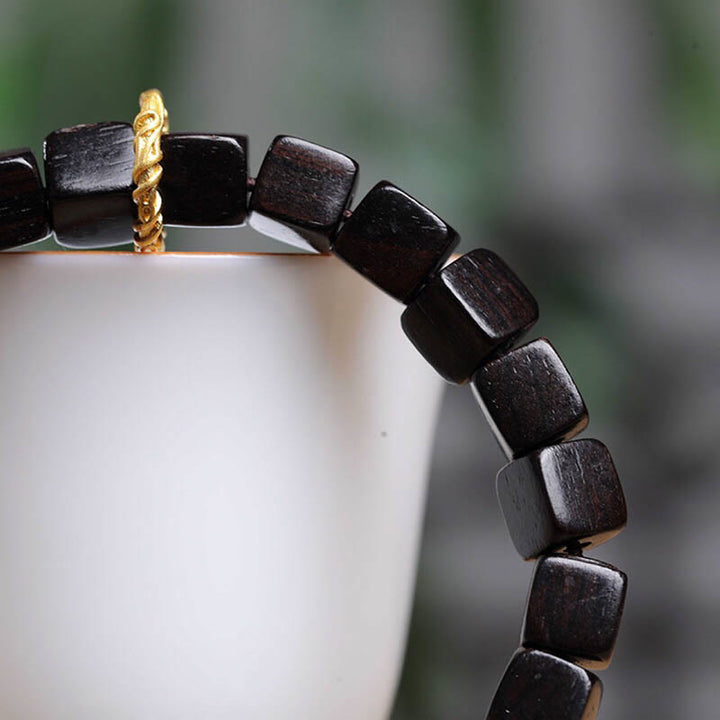 Bracelet de perles carrées en bois d'ébène tibétain Buddha Stones Peace Calm