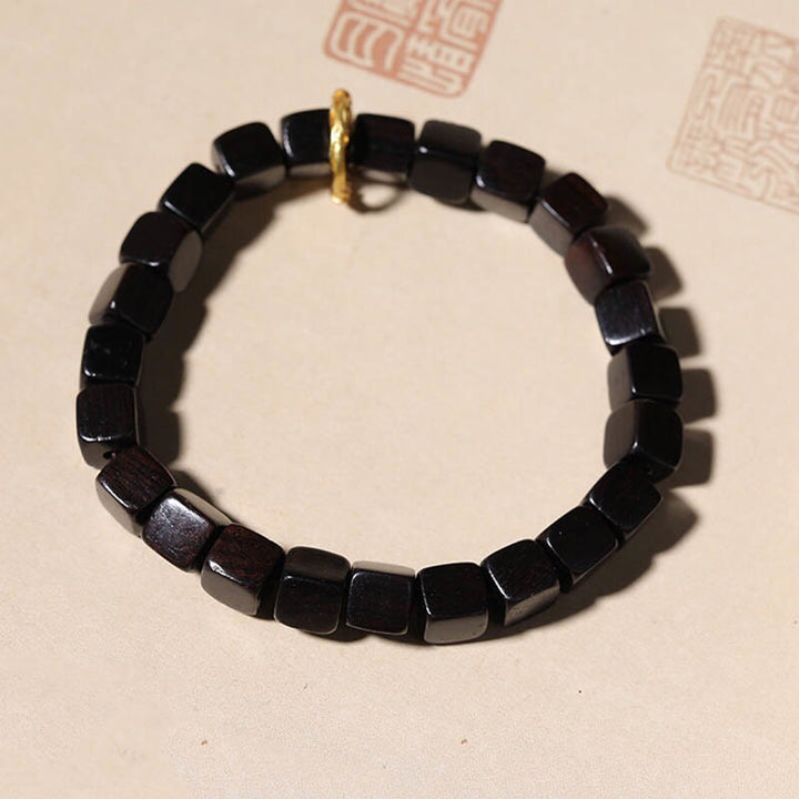 Bracelet de perles carrées en bois d'ébène tibétain Buddha Stones Peace Calm