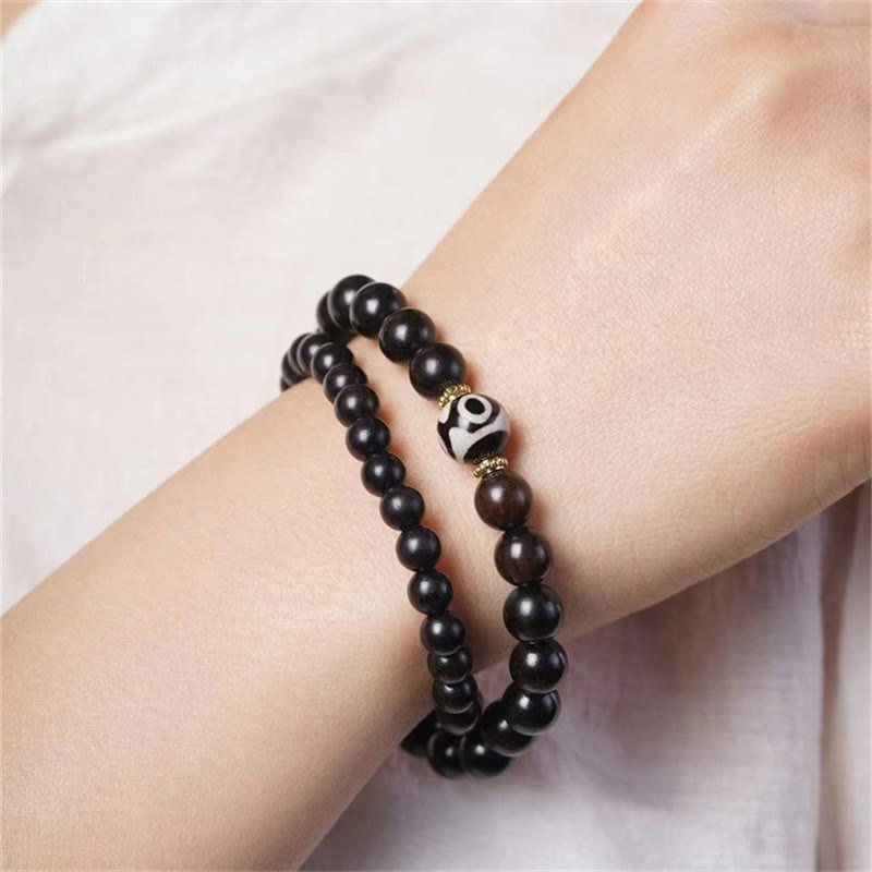 Bracelet double tour en perles dzi en bois d'ébène tibétain et Buddha Stones