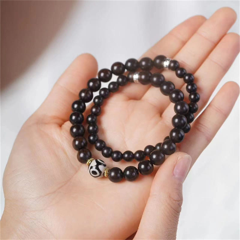 Bracelet double tour en perles dzi en bois d'ébène tibétain et Buddha Stones