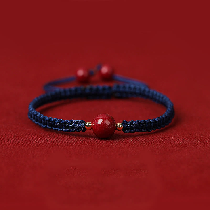 Bracelet porte-bonheur en perles de cinabre avec cordon rouge et Buddha Stones