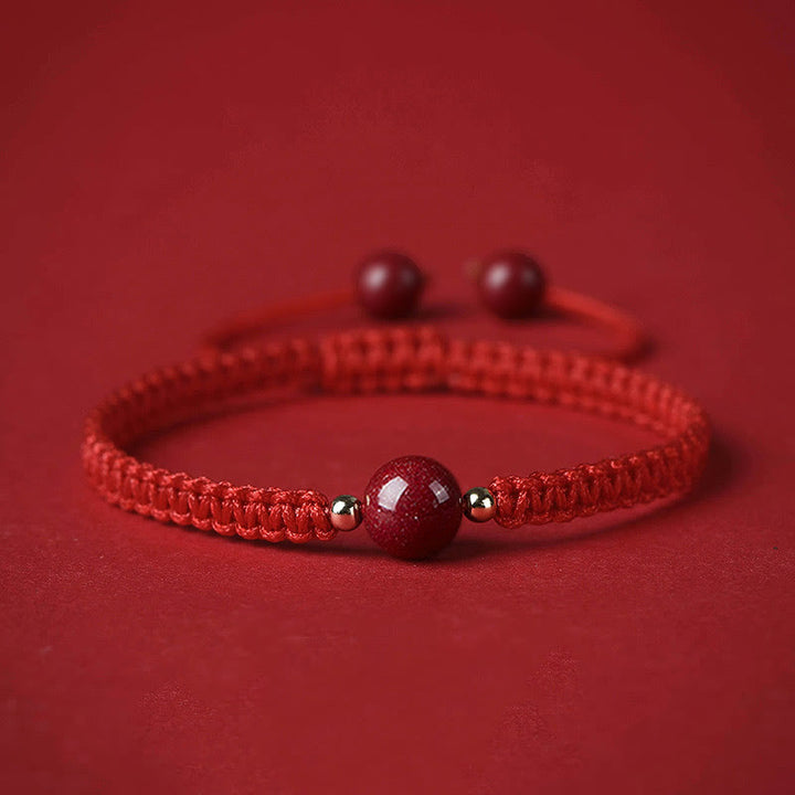 Bracelet porte-bonheur en perles de cinabre avec cordon rouge et Buddha Stones