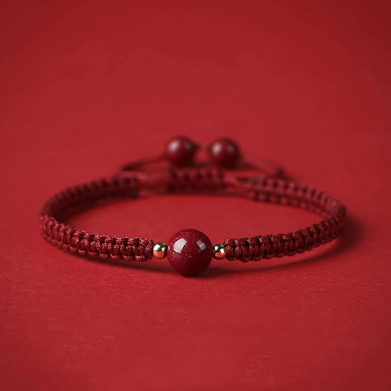 Bracelet porte-bonheur en perles de cinabre avec cordon rouge et Buddha Stones
