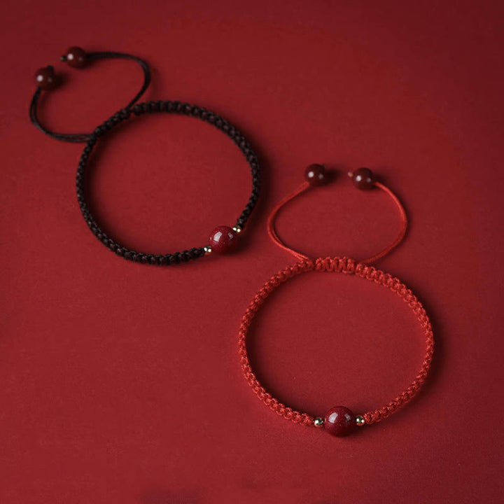 Bracelet porte-bonheur en perles de cinabre avec cordon rouge et Buddha Stones