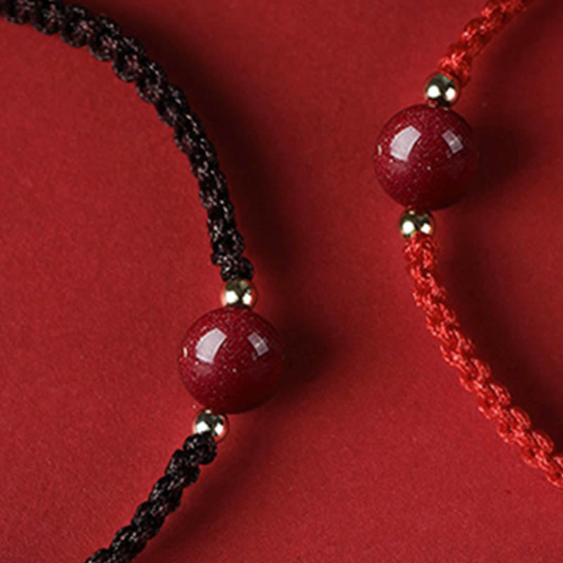 Bracelet porte-bonheur en perles de cinabre avec cordon rouge et Buddha Stones