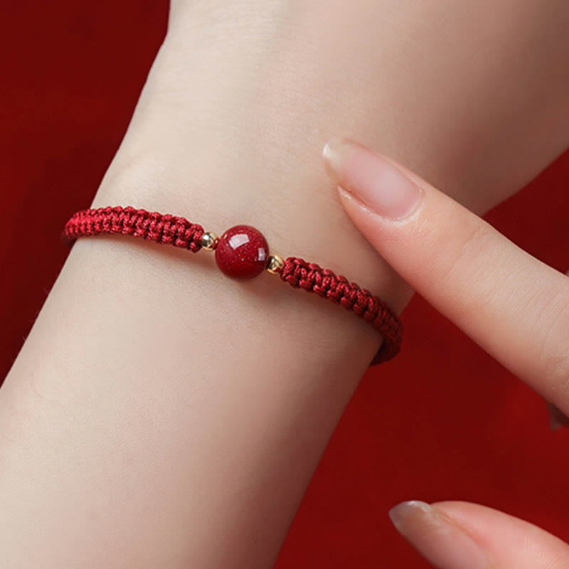 Bracelet porte-bonheur en perles de cinabre avec cordon rouge et Buddha Stones