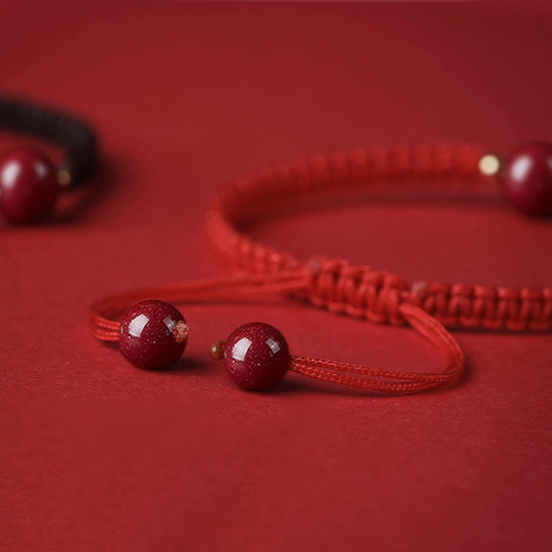 Bracelet porte-bonheur en perles de cinabre avec cordon rouge et Buddha Stones