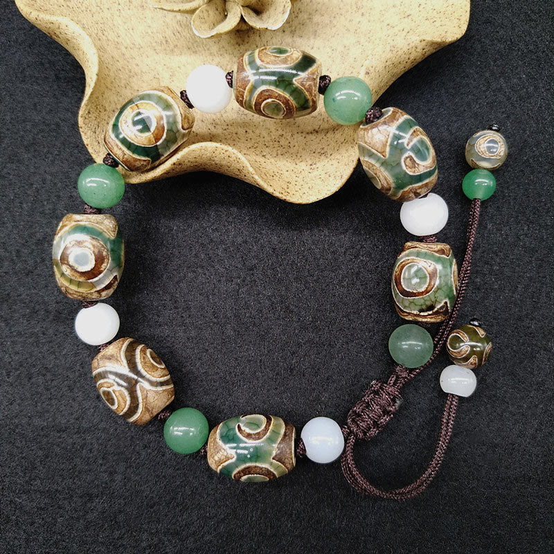 Bracelet tressé Buddha Stones à trois yeux avec perles Dzi et protection de la chance