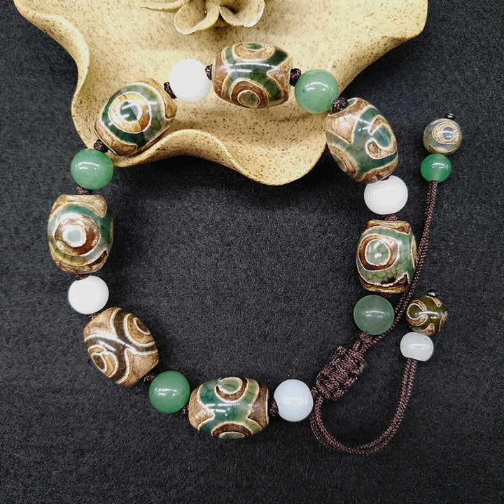 Bracelet tressé Buddha Stones à trois yeux avec perles Dzi et protection de la chance