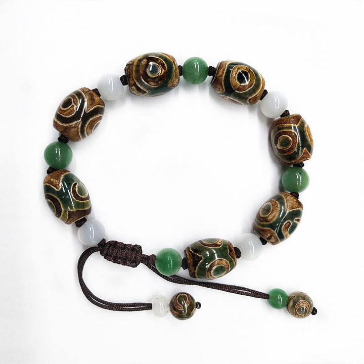 Bracelet tressé Buddha Stones à trois yeux avec perles Dzi et protection de la chance
