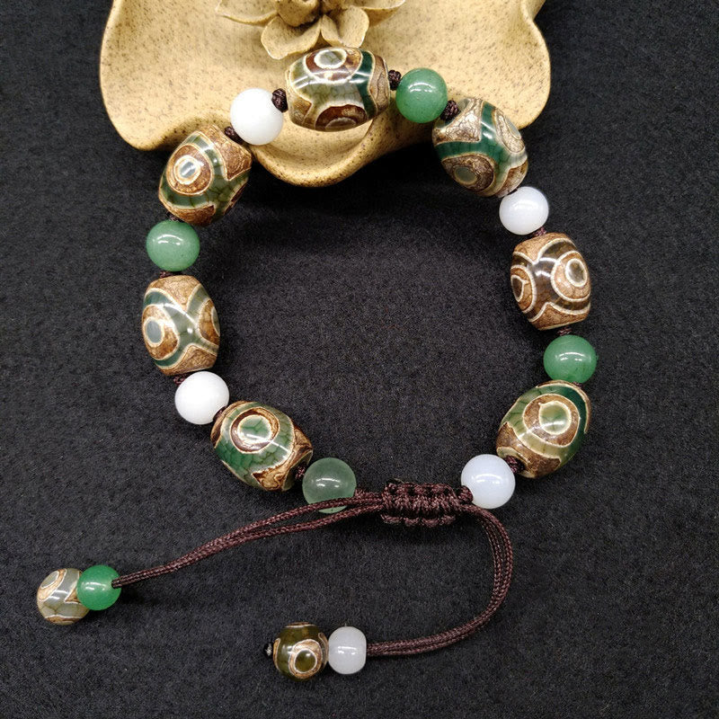 Bracelet tressé Buddha Stones à trois yeux avec perles Dzi et protection de la chance