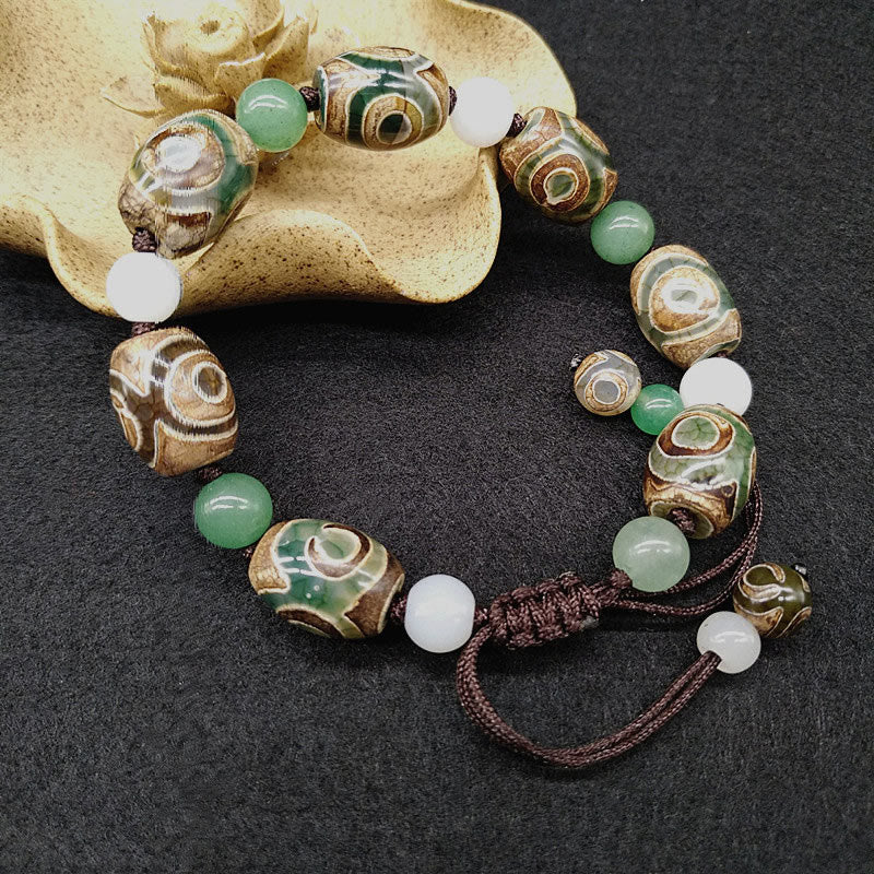 Bracelet tressé Buddha Stones à trois yeux avec perles Dzi et protection de la chance